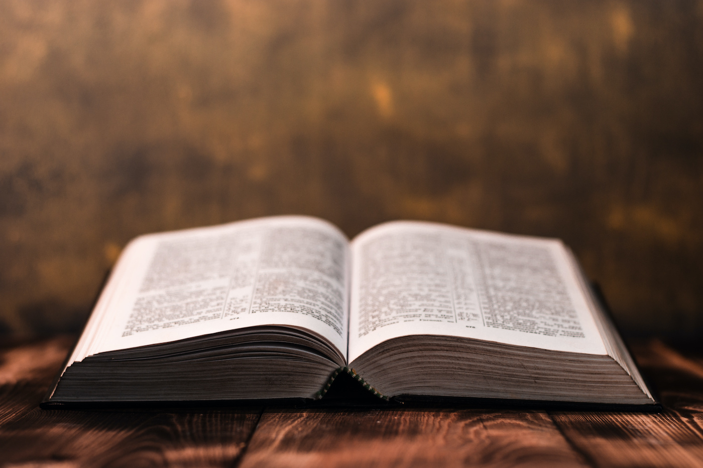 Open Bible on a wooden table